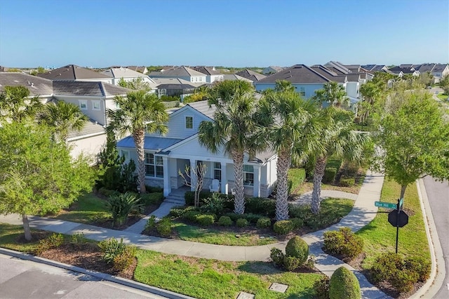 11717 Blue Hill Trl, Lakewood Ranch, FL 34211 - view of front facade with covered porch and a residential view