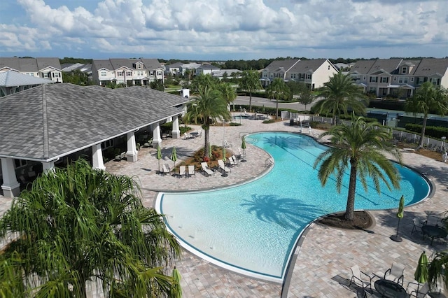 11717 Blue Hill Trl, Lakewood Ranch, FL 34211 - community pool featuring a patio, fence, and a residential view