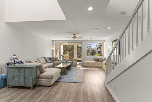 1928 Harbourside Dr Unit 1403, Longboat Key, FL 34228 - living area featuring light wood finished floors, stairs, a ceiling fan, and recessed lighting