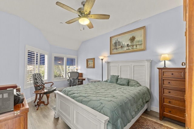1928 Harbourside Dr Unit 1403, Longboat Key, FL 34228 - bedroom featuring light wood finished floors, baseboards, lofted ceiling, and a ceiling fan