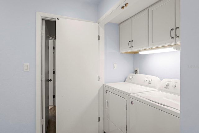 1928 Harbourside Dr Unit 1403, Longboat Key, FL 34228 - laundry area with cabinet space and washing machine and clothes dryer