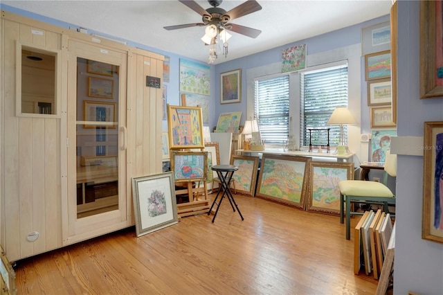 interior space featuring a ceiling fan and wood finished floors