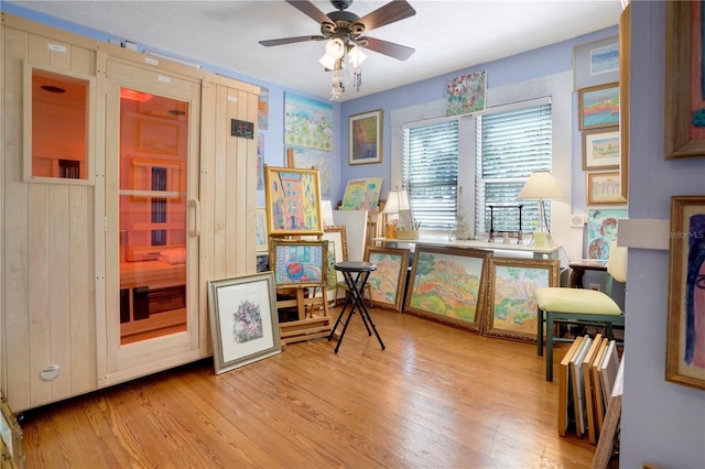 interior space with ceiling fan and wood finished floors
