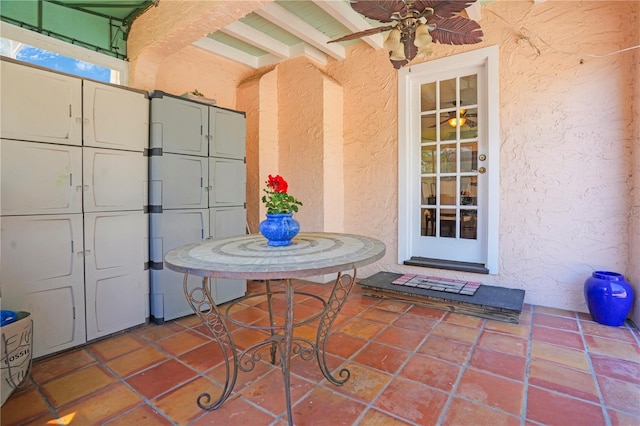 view of patio featuring a package area and ceiling fan