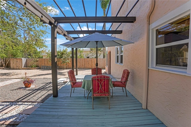 deck with fence private yard, outdoor dining area, and a pergola