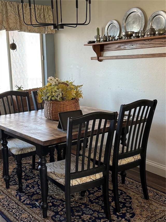 2330 Canal Dr Unit G27, Bradenton, FL 34207 - dining room featuring baseboards and wood finished floors