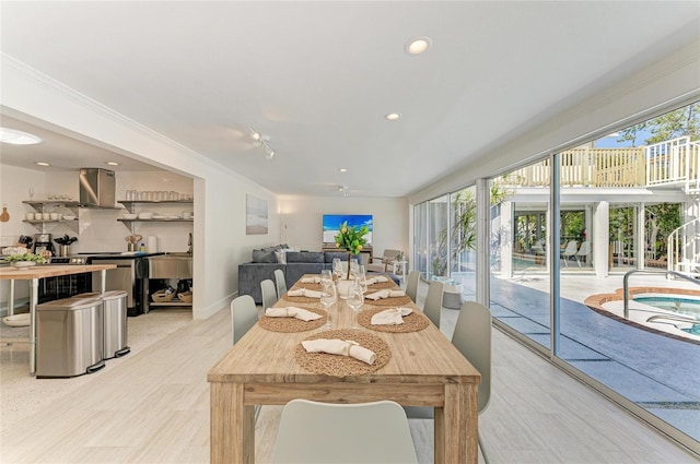 dining space featuring plenty of natural light, recessed lighting, and crown molding