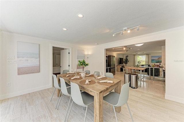 dining room featuring light wood-type flooring, recessed lighting, baseboards, and ornamental molding