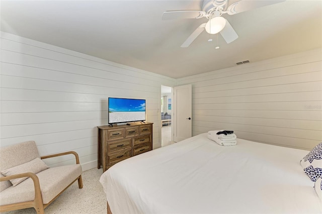 bedroom featuring speckled floor, a ceiling fan, and visible vents