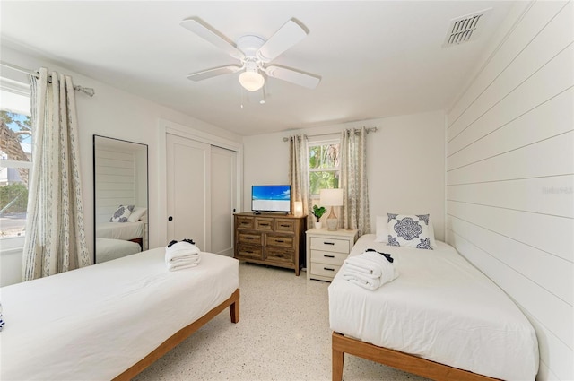 bedroom featuring visible vents, a closet, and ceiling fan