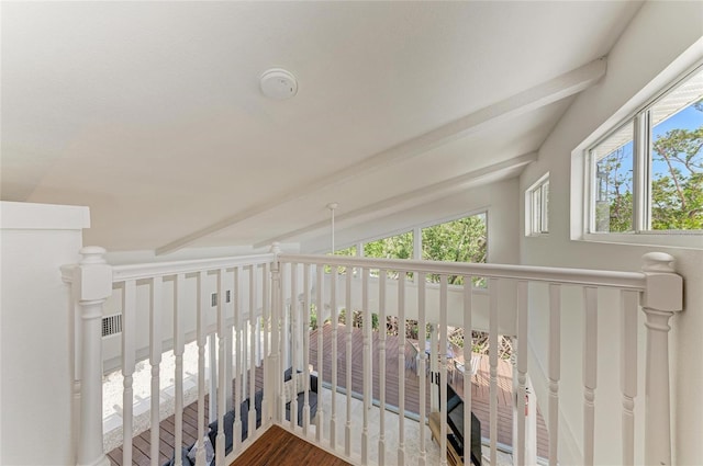 hall with vaulted ceiling with beams