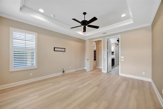 12711 Del Corso Loop, Bradenton, FL 34211 - unfurnished bedroom featuring a tray ceiling, crown molding, light wood-type flooring, recessed lighting, and baseboards