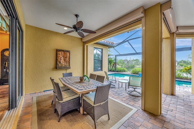 12711 Del Corso Loop, Bradenton, FL 34211 - view of patio featuring ceiling fan, an outdoor pool, outdoor dining space, and glass enclosure