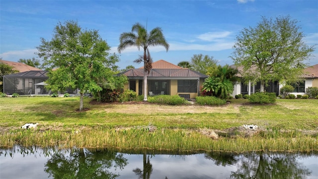 12711 Del Corso Loop, Bradenton, FL 34211 - rear view of property featuring a water view, a lawn, and a tiled roof