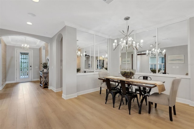 12711 Del Corso Loop, Bradenton, FL 34211 - dining area featuring a chandelier, arched walkways, light wood-style floors, ornamental molding, and recessed lighting