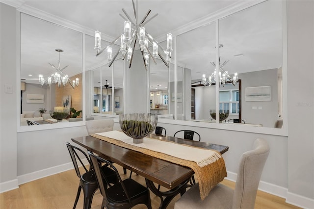 12711 Del Corso Loop, Bradenton, FL 34211 - dining area featuring a chandelier, wood finished floors, and ornamental molding