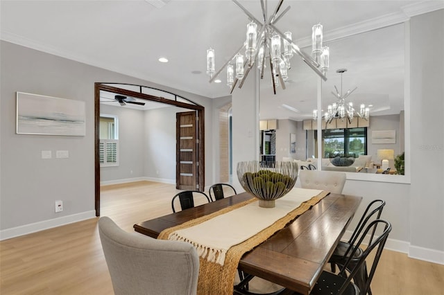 12711 Del Corso Loop, Bradenton, FL 34211 - dining area with a chandelier, light wood finished floors, recessed lighting, healthy amount of natural light, and ornamental molding