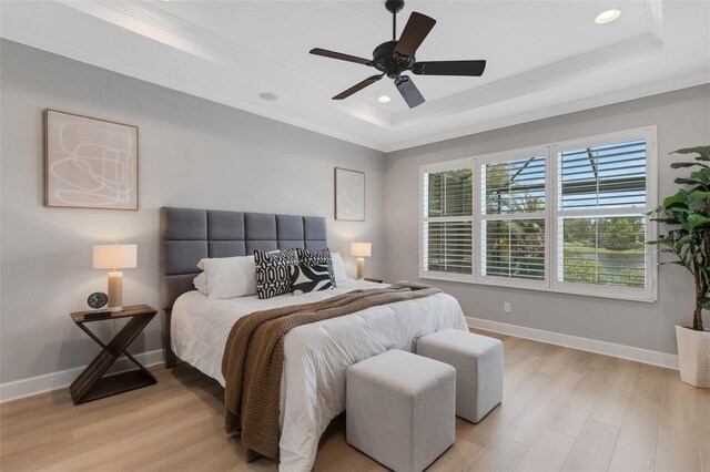 12711 Del Corso Loop, Bradenton, FL 34211 - bedroom featuring a tray ceiling, light wood-type flooring, recessed lighting, a ceiling fan, and ornamental molding