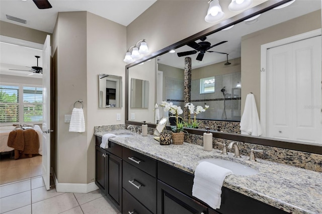 12711 Del Corso Loop, Bradenton, FL 34211 - ensuite bathroom with ceiling fan, double vanity, tile patterned flooring, and a tile shower