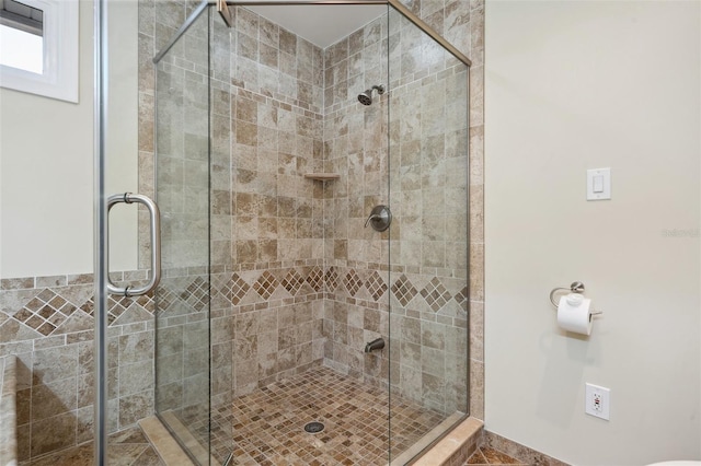 full bath featuring a shower stall