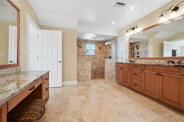 full bath with recessed lighting, visible vents, a walk in shower, vanity, and tasteful backsplash