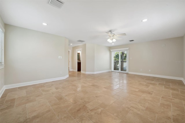 spare room with a ceiling fan, stone finish floor, visible vents, baseboards, and recessed lighting