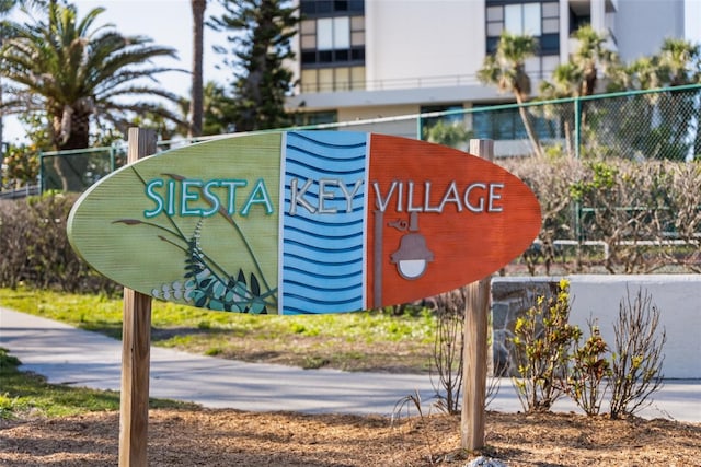 community sign with fence