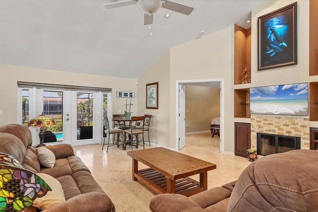 4704 Coral Lake Dr, Bradenton, FL 34210 - living room featuring high vaulted ceiling, baseboards, a ceiling fan, a glass covered fireplace, and french doors