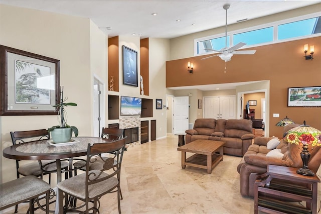 4704 Coral Lake Dr, Bradenton, FL 34210 - living area featuring a high ceiling, visible vents, a skylight, and ceiling fan