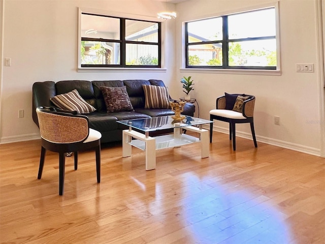 interior space with baseboards and light wood-style flooring