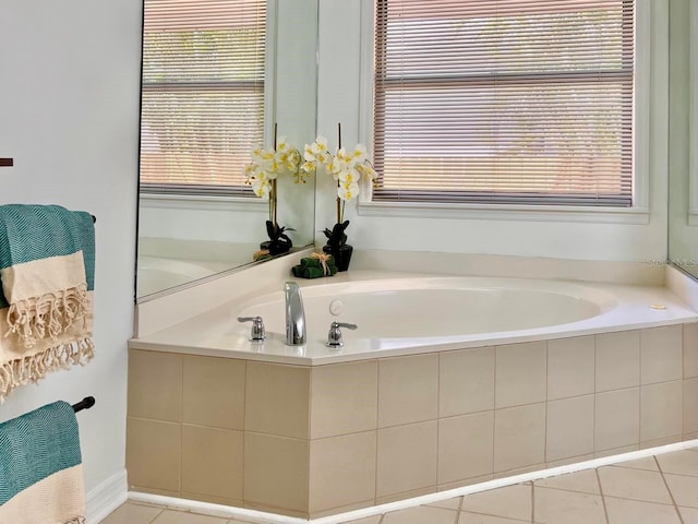 full bathroom featuring tile patterned flooring and a bath
