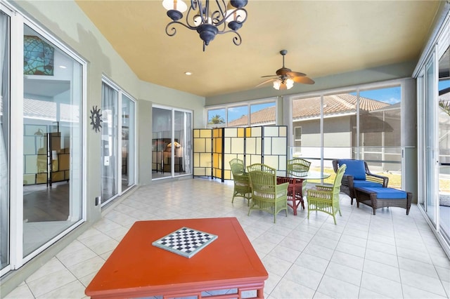 1118 Deardon Dr, Venice, FL 34292 - sunroom with tile patterned floors and a chandelier