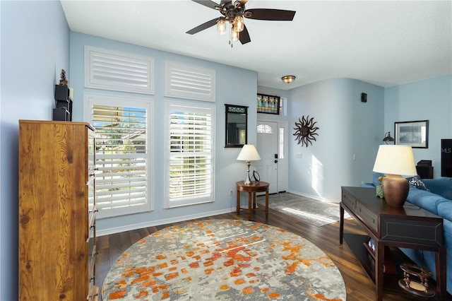 1118 Deardon Dr, Venice, FL 34292 - living area featuring a ceiling fan, dark wood-style floors, and baseboards