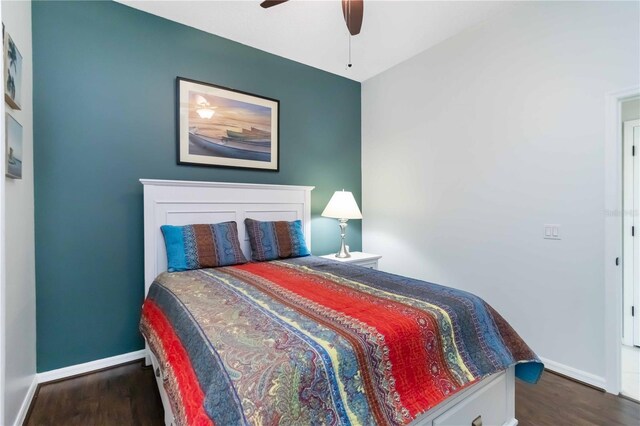 1118 Deardon Dr, Venice, FL 34292 - bedroom with a ceiling fan, dark wood-style floors, and baseboards
