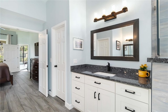 1118 Deardon Dr, Venice, FL 34292 - ensuite bathroom with connected bathroom, wood tiled floor, and vanity