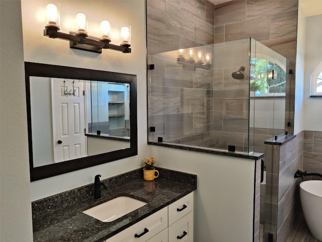 1118 Deardon Dr, Venice, FL 34292 - full bath with a soaking tub, vanity, tile walls, and a tile shower