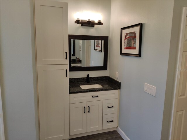 1118 Deardon Dr, Venice, FL 34292 - bathroom with baseboards, wood finished floors, and vanity