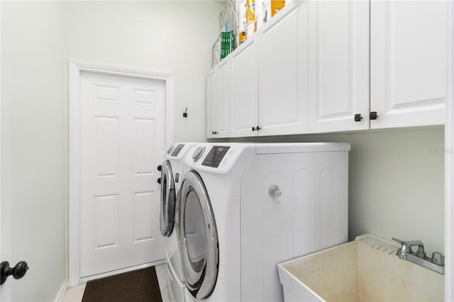 1118 Deardon Dr, Venice, FL 34292 - washroom with washer and dryer, cabinet space, and a sink