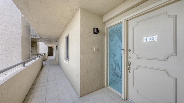 2675 Gulf Of Mexico Dr Unit 403, Longboat Key, FL 34228 - doorway to property featuring stucco siding and a balcony