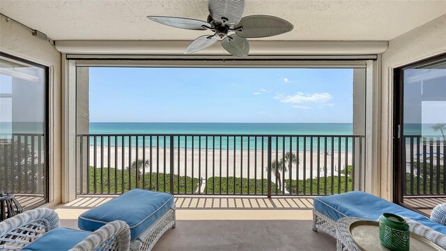 2675 Gulf Of Mexico Dr Unit 403, Longboat Key, FL 34228 - balcony with a water view, a ceiling fan, and a beach view