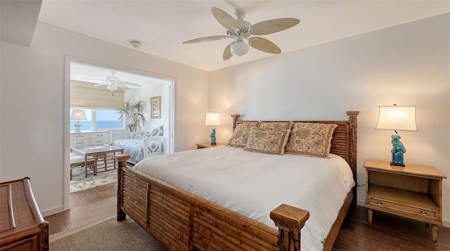 2675 Gulf Of Mexico Dr Unit 403, Longboat Key, FL 34228 - bedroom featuring baseboards, ceiling fan, and wood finished floors