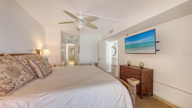 2675 Gulf Of Mexico Dr Unit 403, Longboat Key, FL 34228 - bedroom with baseboards, ceiling fan, carpet flooring, and connected bathroom