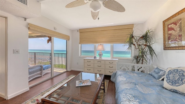 2675 Gulf Of Mexico Dr Unit 403, Longboat Key, FL 34228 - bedroom with access to outside, baseboards, visible vents, and wood finished floors