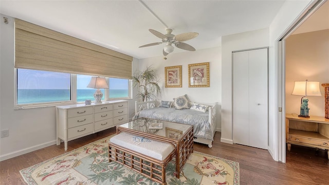 2675 Gulf Of Mexico Dr Unit 403, Longboat Key, FL 34228 - bedroom featuring baseboards, a ceiling fan, a closet, and wood finished floors