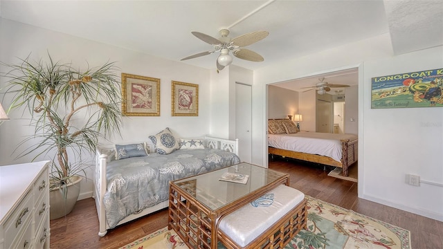 2675 Gulf Of Mexico Dr Unit 403, Longboat Key, FL 34228 - bedroom featuring baseboards, ceiling fan, wood finished floors, and a closet
