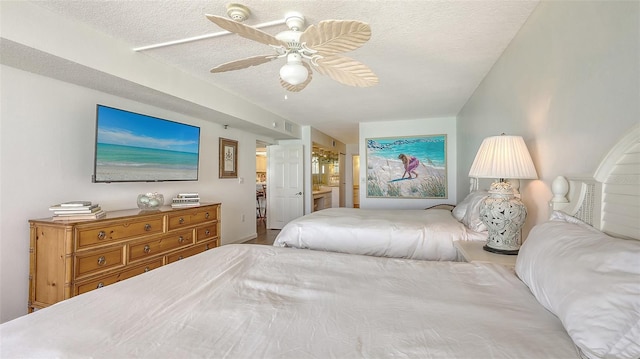 2675 Gulf Of Mexico Dr Unit 403, Longboat Key, FL 34228 - bedroom with a textured ceiling, ceiling fan, and ensuite bath