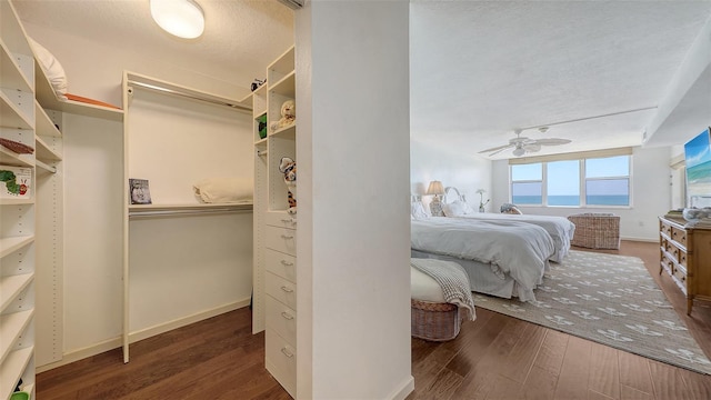 2675 Gulf Of Mexico Dr Unit 403, Longboat Key, FL 34228 - bedroom featuring baseboards, a textured ceiling, and wood finished floors