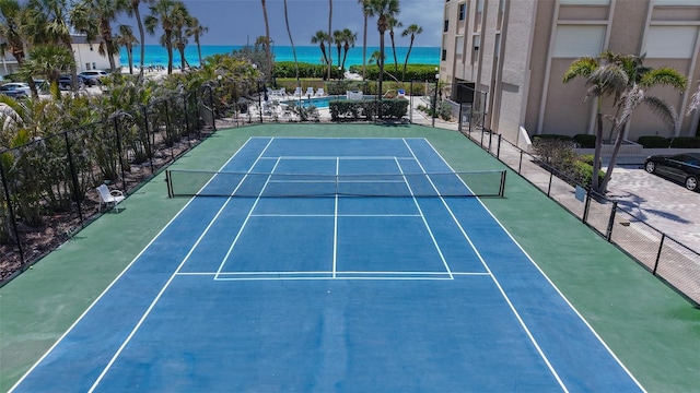 2675 Gulf Of Mexico Dr Unit 403, Longboat Key, FL 34228 - view of tennis court with a beach view, a water view, and fence