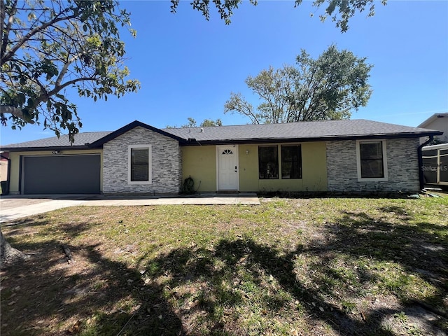ranch-style house with a front lawn, driveway, an attached garage, and stone siding