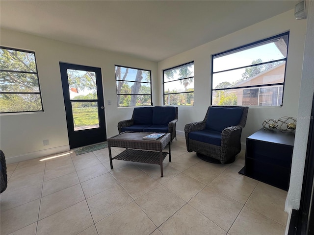 sitting room with light tile patterned flooring and baseboards